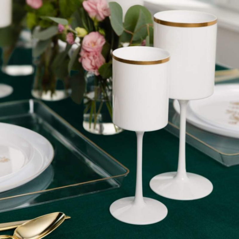 white and gold plastic stemmed wine glass